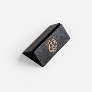 Black wooden card stand embossed with the L&P logo shown from an angle above 