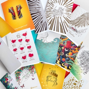 Showiing a large selectiion of greeting cards from L&P in a big pile, used for any occassion